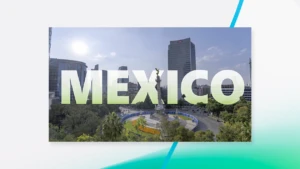 The word Mexico with buildings in the background over an abstract backdrop.