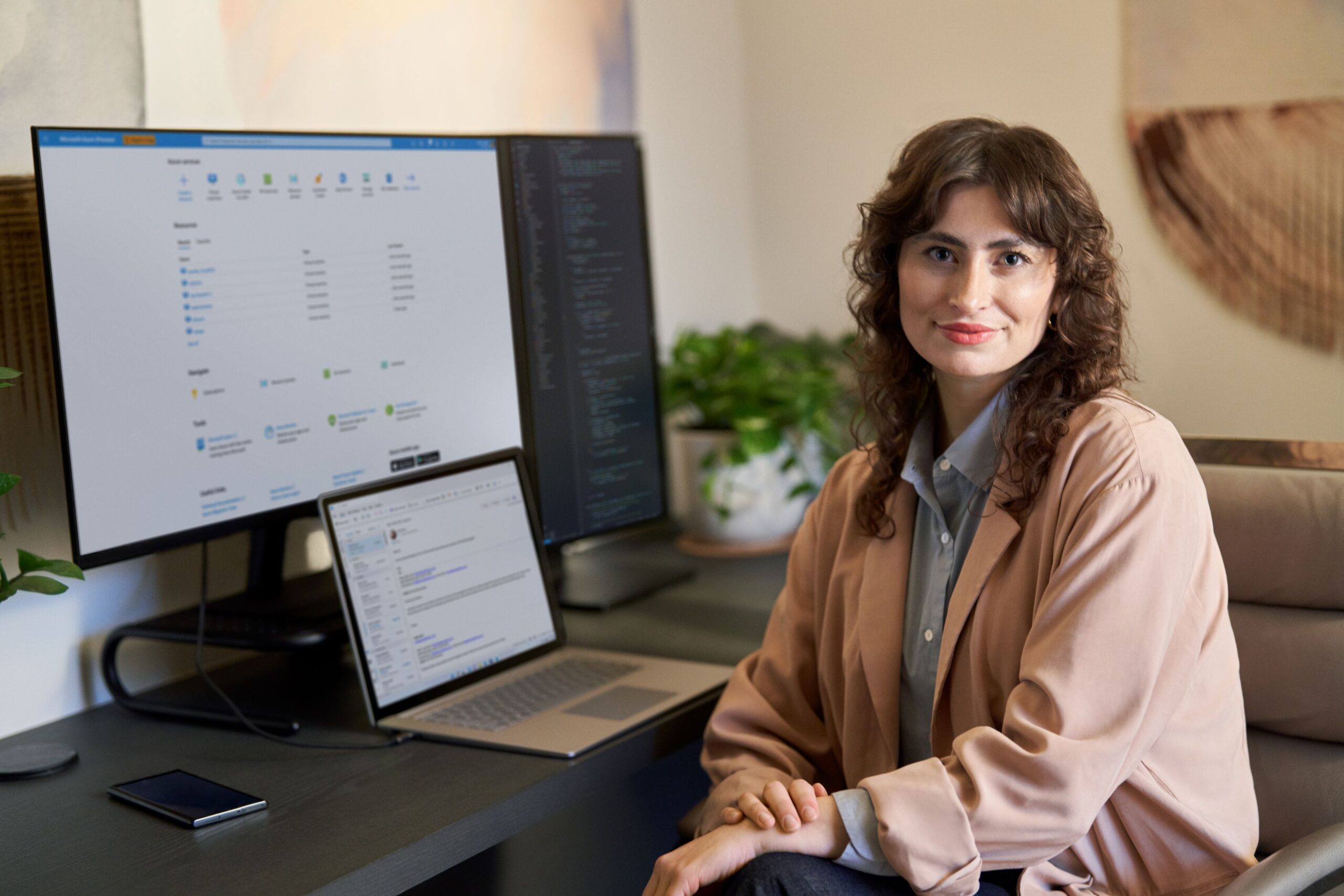 a person sitting at a desk in front of a computer