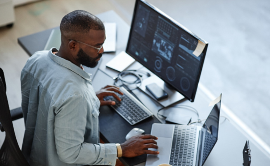 a man looking at a laptop