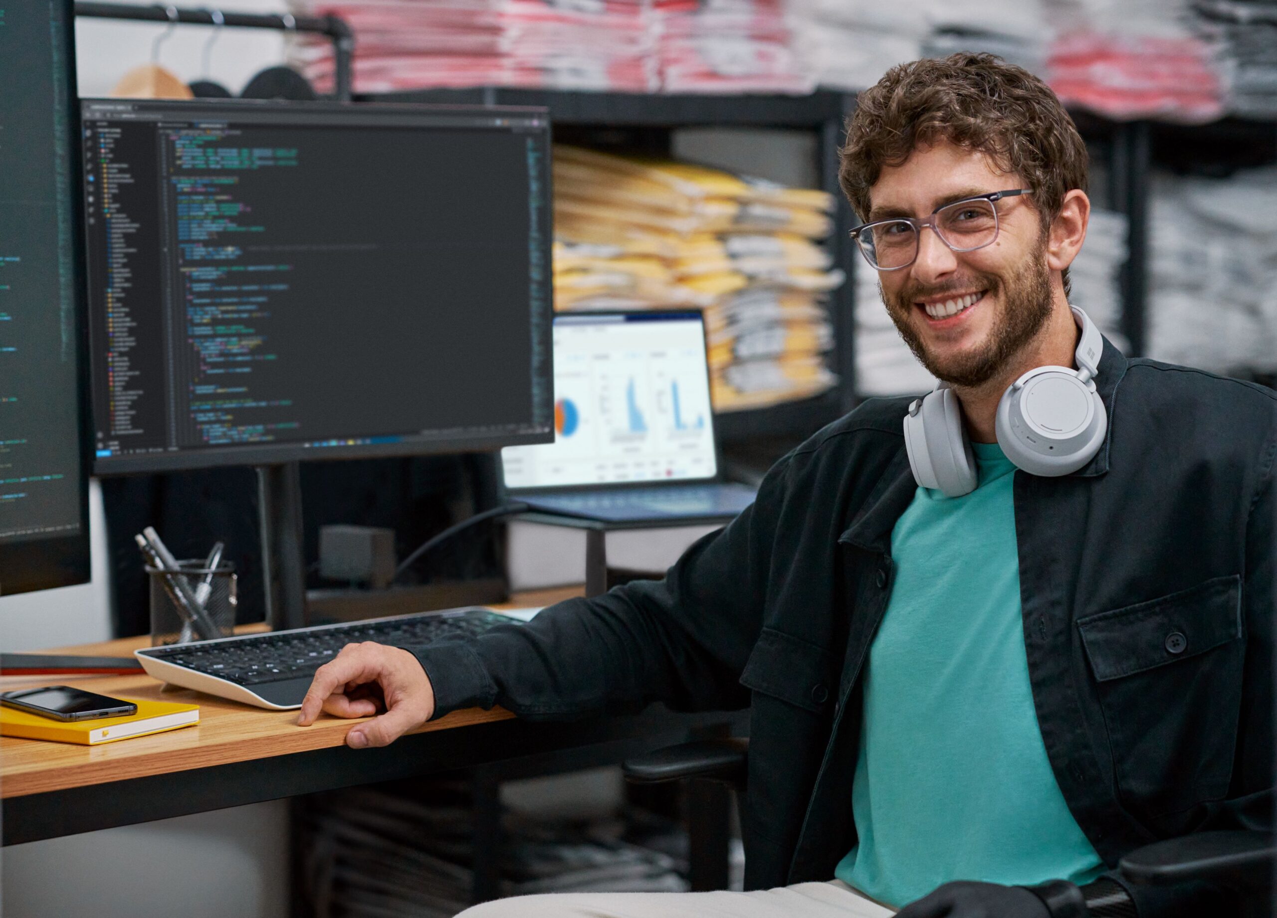 a man sitting in front of a computer