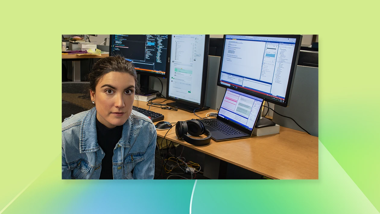 a woman sitting in front of a computer