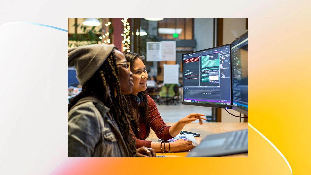 Two women looking at computer