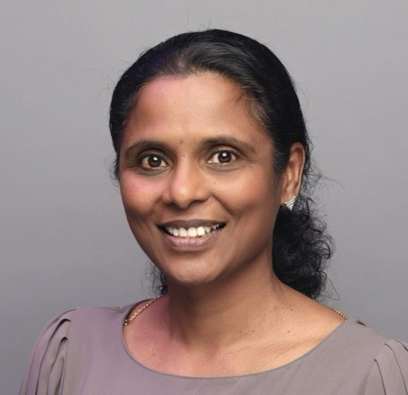A woman smiling for a picture