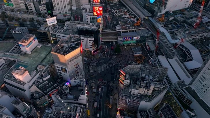 Overhead night view of a busy cityscape.