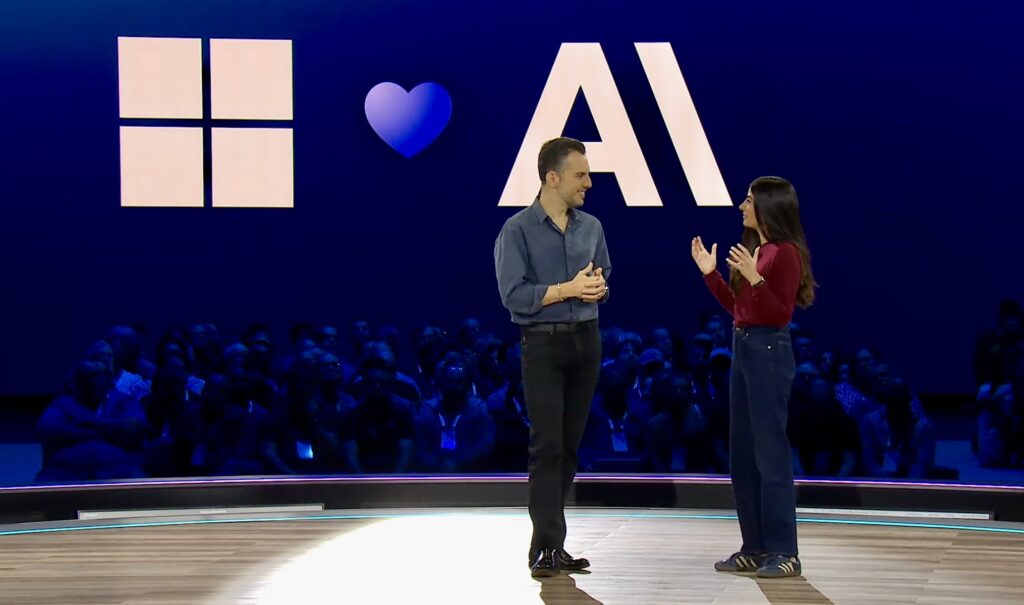 Two speakers on stage at Microsoft Ignite 2025.