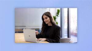 A woman working on a laptop.