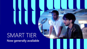 Two people working at desk. Text reads "Smart tier. Now generally available."