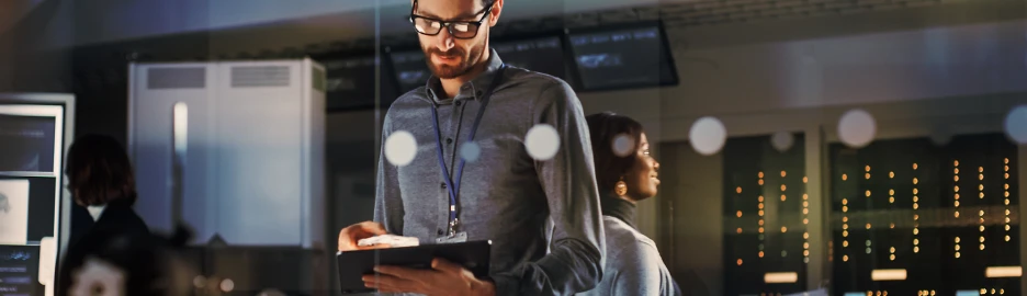 Person looking down at tablet.