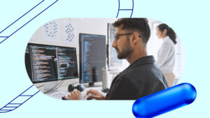 A man works at a computer.
