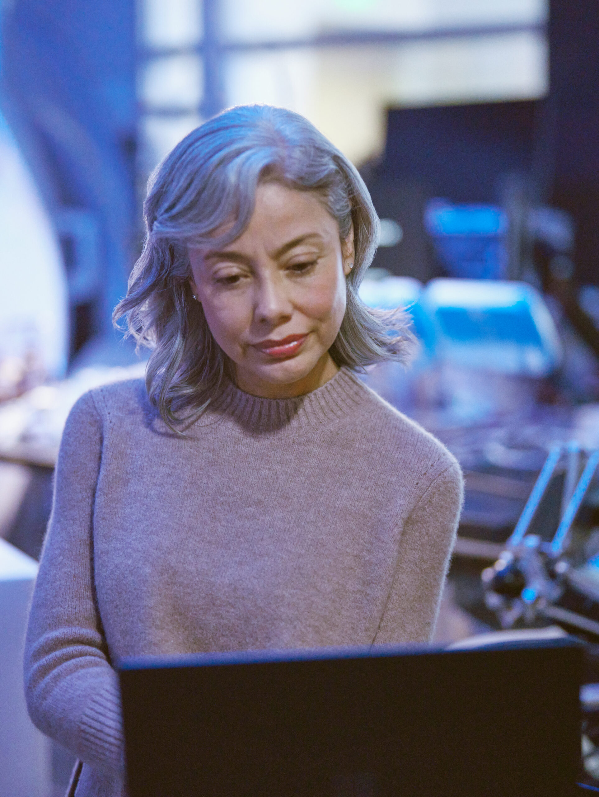 person looking ta the laptop screen in scientific setting